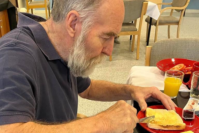 Gordon buttering toast for breakfast